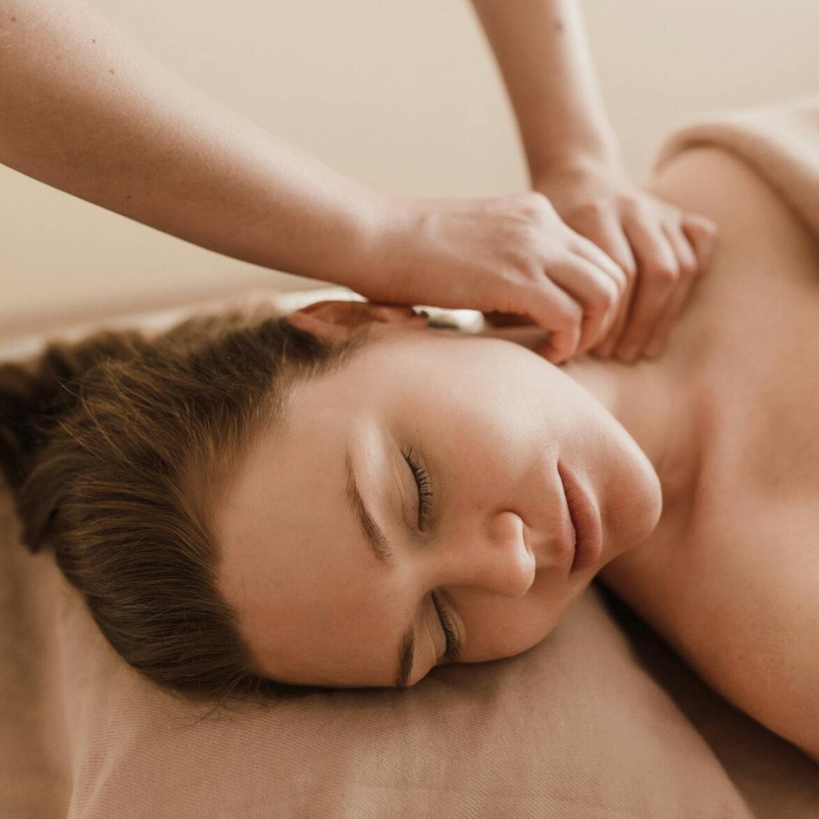 Joanna performing Lomi Face Therapy, a restorative facial and intraoral technique